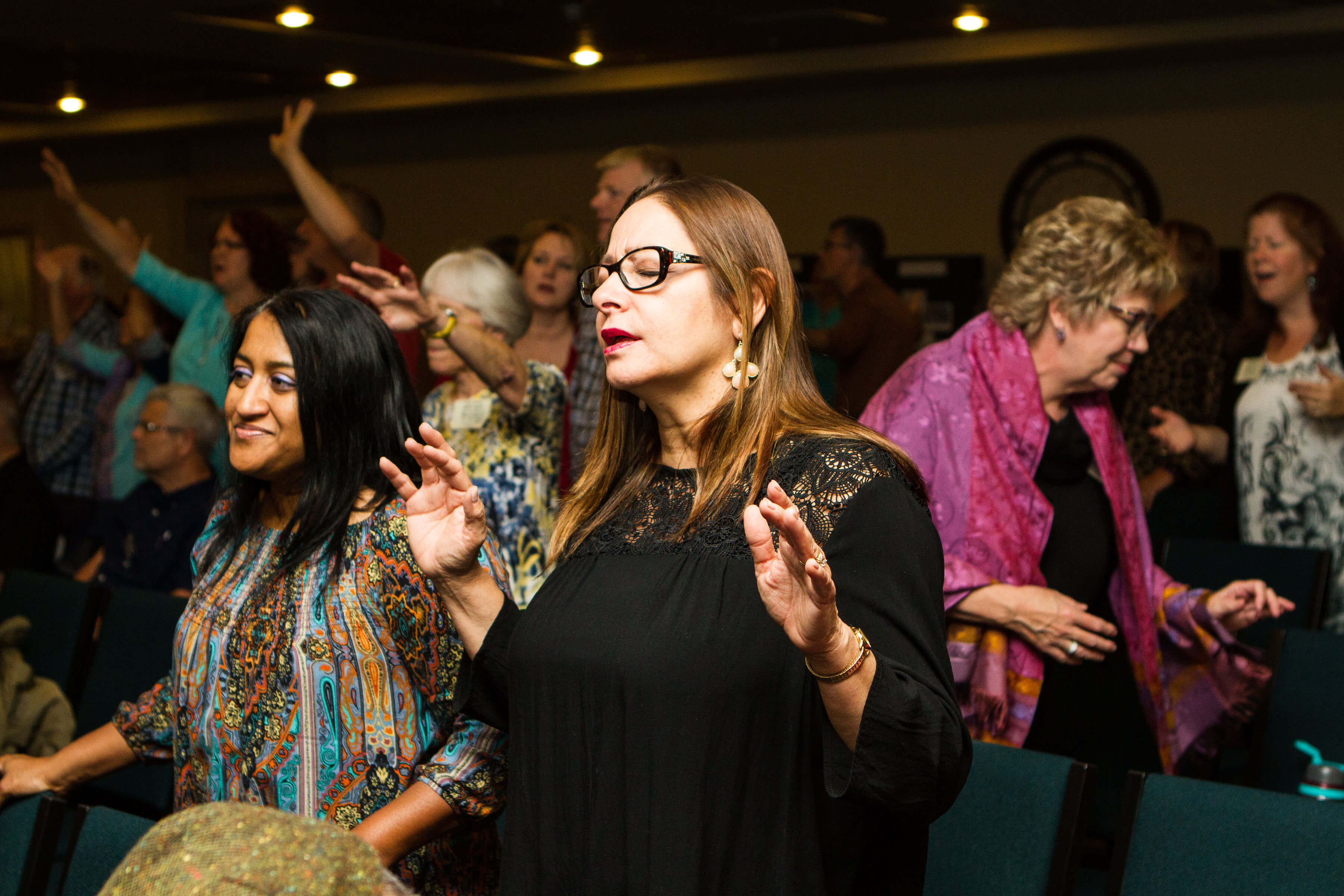 woman worshipping at a conference